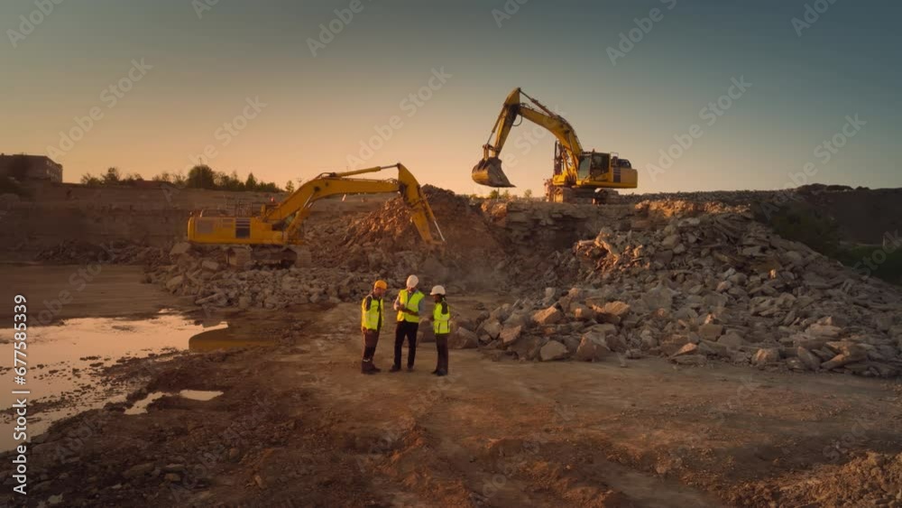 Aerial Drone Shot Of Construction Site With Excavators On Sunny Day: Diverse Team of Real Estate Developers Discussing Project. Engineer, Architect, Inspector Talking About New Building, Using Tablet.