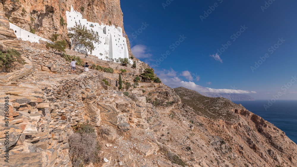 Fototapeta premium The Hozoviotissa Monastery standing on a rock over the Aegean sea in Amorgos island timelapse hyperlapse, Greece.
