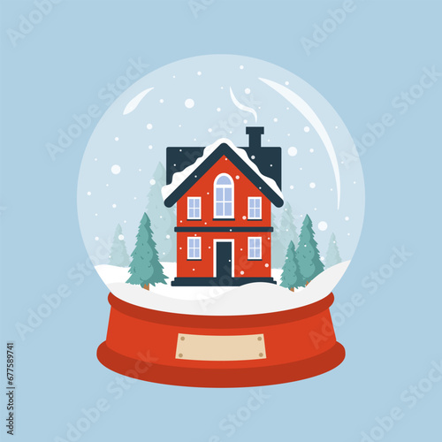 Glass snow globe with cozy house. Christmas decorative ball with winter landscape. Holiday snowball with snowflakes isolated on blue background. Vector illustration in flat cartoon style. photo