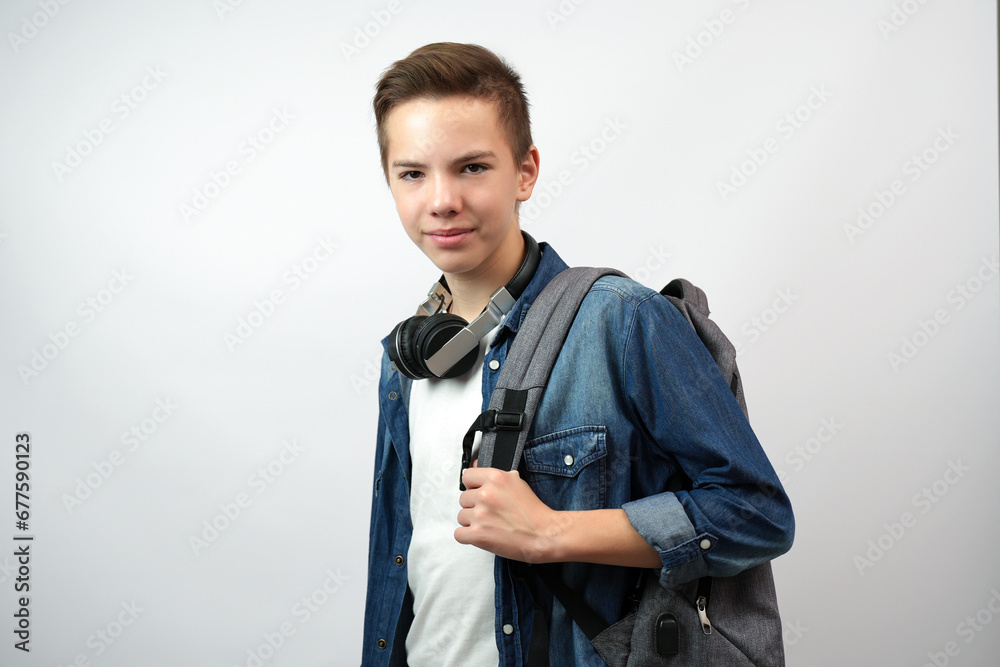 Portrait of teenage boy student, standing looking at camera