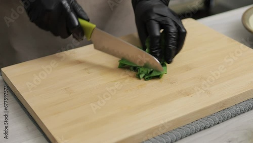 Wholesome Cooking. Chef's Skillful Hands Chop Kale in a Home Kitchen, Transforming Fresh Ingredients into Delicious, Nutrient-Packed Meals