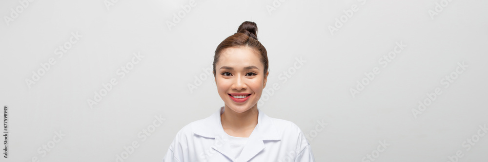 Young attractive asian woman in a white coat Young attractive asian woman in a white coat