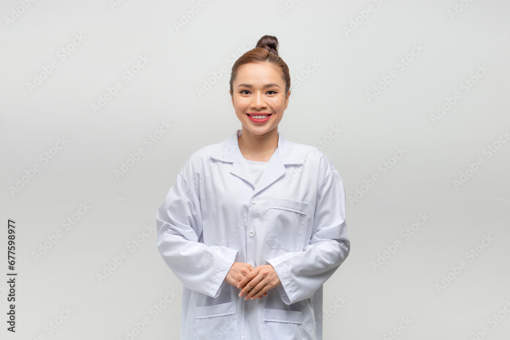 Portrait of young female doctor on light background Portrait of young female doctor on light background