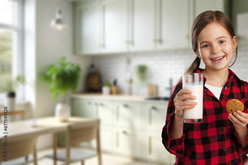 healthy young girl drinking milk at home. healthy young girl drinking milk at home.