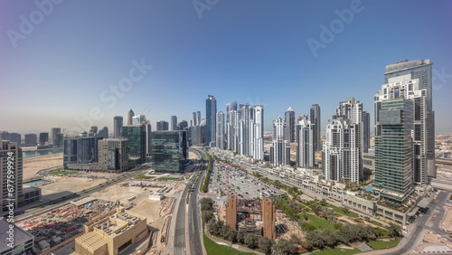 Panorama of Bay Avenue with modern towers residential development in Business Bay aerial all day timelapse © neiezhmakov