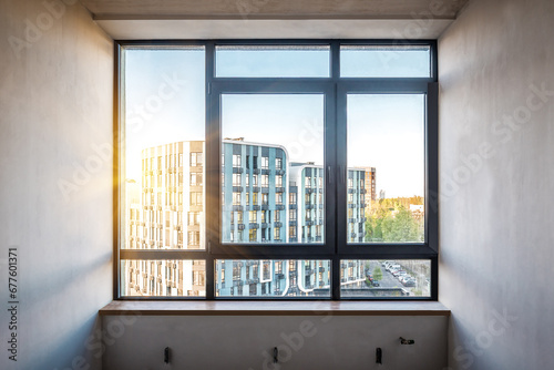 New plastic pvc window with black metal frame installed at modern room