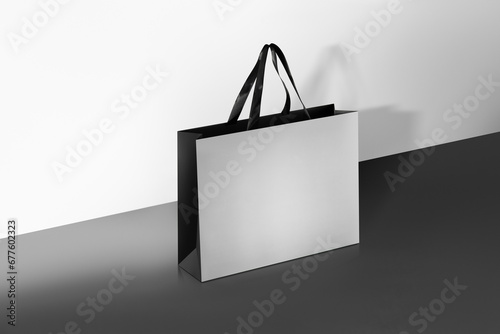 Paper shopping bags mockup with black handles.
