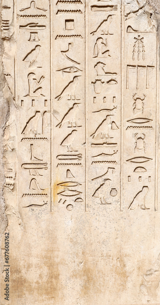 Obraz premium Ancient Egyptian hieroglyphs on stone wall, Karnak Temple Complex, Luxor, Egypt, Africa. Stone carvings with hieroglyphs at Karnak temple, Luxor, Thebes