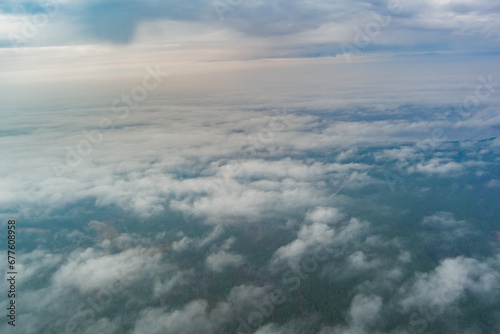 Fototapeta Naklejka Na Ścianę i Meble -  Photo from a high altitude. High clouds and humidity over the forest.