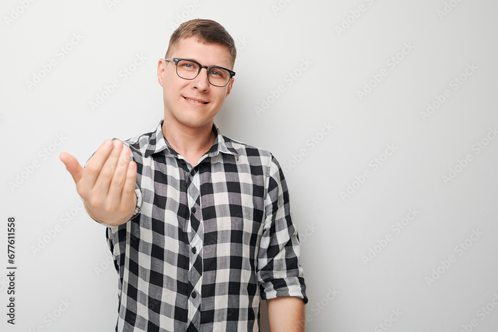 Portrait of confident man chooses you points finger at camera isolated on white studio background. Welcome gesture, join our team concept. Portrait of confident man chooses you points finger at camera isolated on white studio background. Welcome gesture, join our team concept.