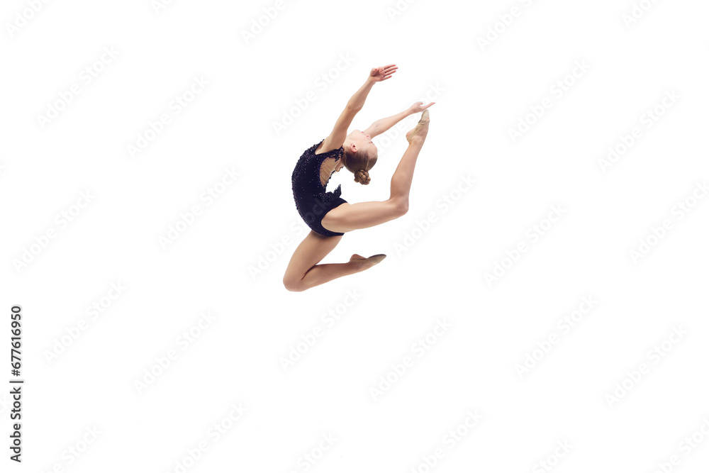 Artistic, talented, flexible girl, rhythmic gymnast in motion, performing against white studio background. Hugh jump. Concept of choreography, hobby, art, sport, childhood and performance