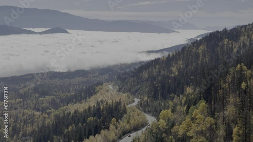 Above the Cloudscape: Bird's Eye Capture of Fall Colors, Mountains, and Misty Valley photo
