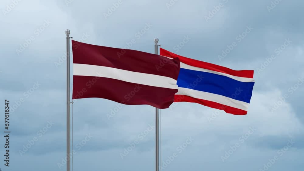Kingdom of Thailand and Latvia flag waving together on cloudy sky, endless seamless loop, two country cooperation concept Kingdom of Thailand and Latvia flag waving together on cloudy sky, endless seamless loop, two country cooperation concept