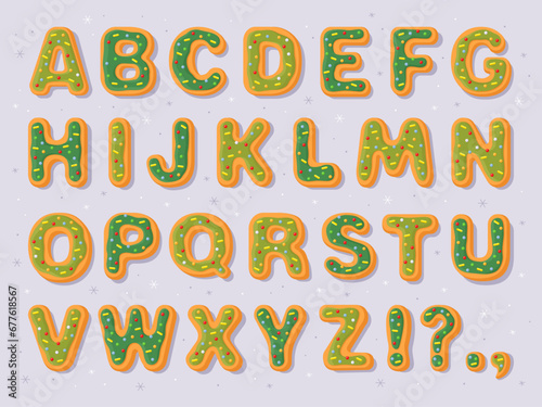 New Year's gingerbread cookies in the form of letters. English alphabet, bold uneven funny font for Christmas card, flyer, banner, poster. Green holiday gingerbread cookies on a gray background