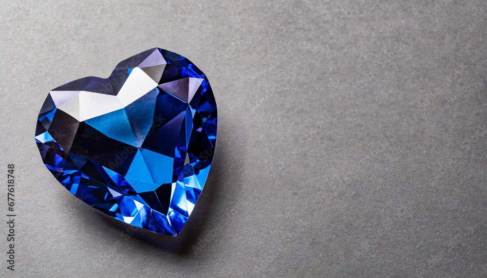 Indigo heart shaped diamond on grey background and copy space on a side Indigo heart shaped diamond on grey background and copy space on a side