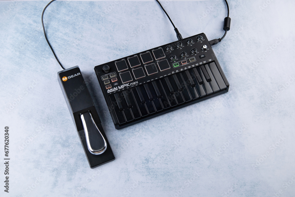 piano style Sustain Pedal MAudio SP2 brand lie next to the AKAI MPK