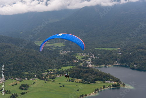 Beautiful landcape near Lake Bohinj in northern Slovenia near Austria in the Julian Alps with parachutist
