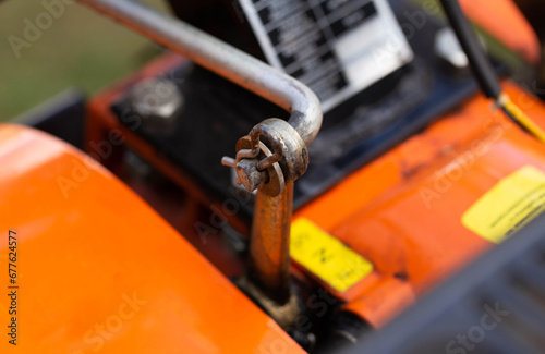 cotter pin for adjusting the gear lever in the walk-behind tractor before running in and starting work. Close-up, industry