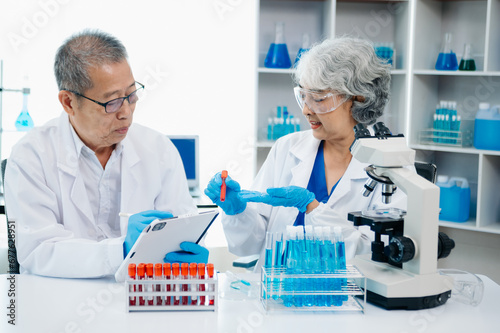Scientist two woman with tablet and laptop, laboratory and ecofriendly science. Agriculture, research and scientists with online reading, test samples