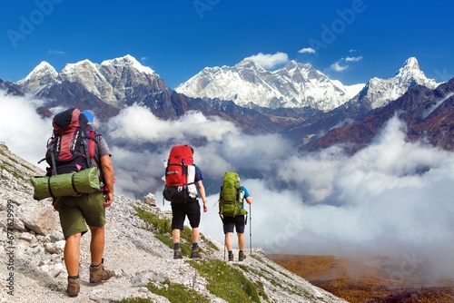Mount Everest, Mt Ama Dablam, Lhotse peak, three hikers photo
