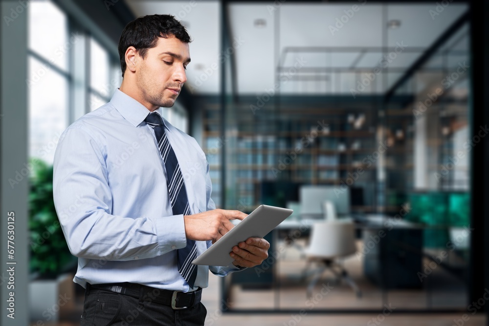 Smiling business worker wearing suit hold digital tablet. Smiling business worker wearing suit hold digital tablet.