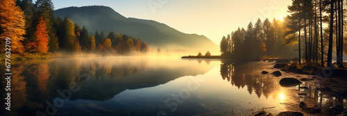 Beautiful autumn forest scene . Colorful morning view on foggy lake and mountains at sunrise time. Beauty of nature concept background.