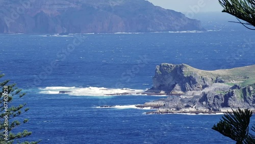 Ocean waves crash on Nepean Island Norfolk Australia at midday, static photo