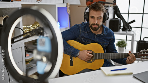 Canvastavla Check out this passionate young hispanic man nailing classical guitar melody in