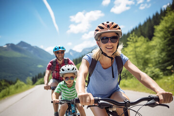 Cycling family of three in mountain road
