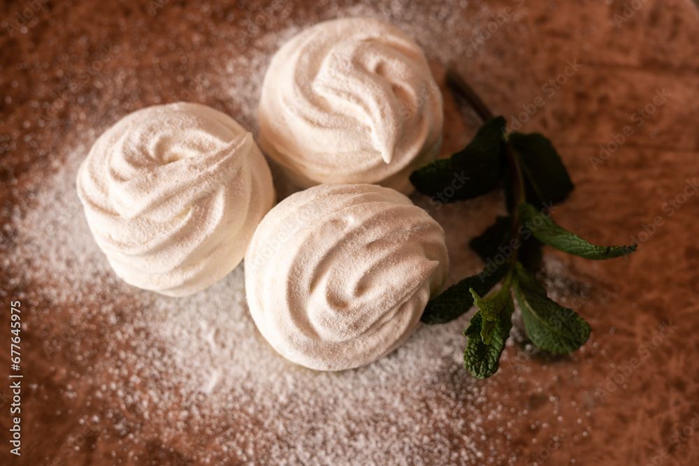 Homemade white marshmallows on a plate close-up. Homemade white marshmallows on a plate close-up.