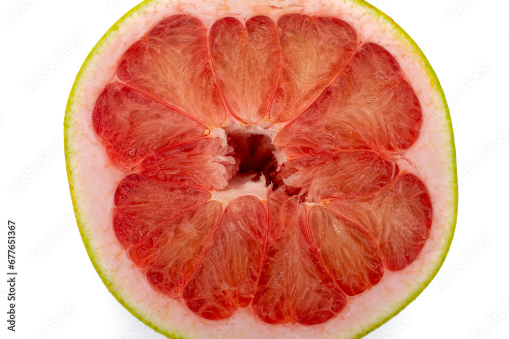 Close up photo of a pomelo grapefruit citrus cross section cut in half showing juicy texture Close up photo of a pomelo grapefruit citrus cross section cut in half showing juicy texture
