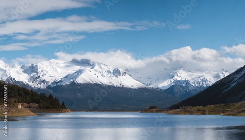 Awesome mountain winter landscape with snow capped mountains with blue lake in front. Nature and travel concept © grahof_photo