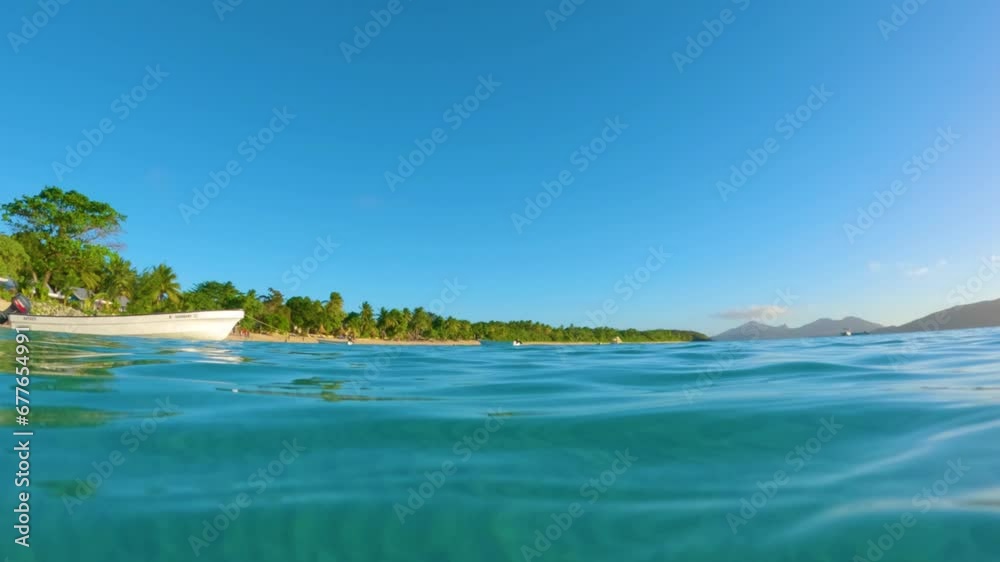 Wild beautiful tropical beach shot on the surface of the water