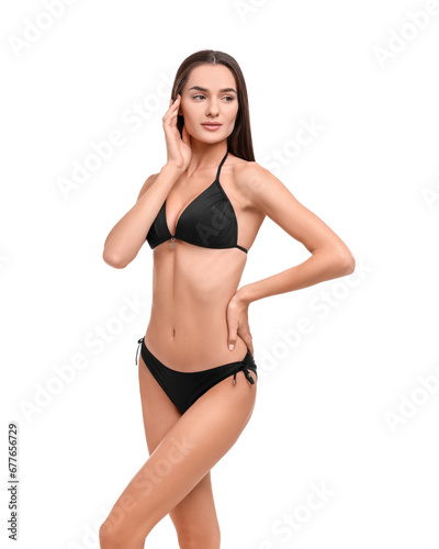 Young woman in stylish bikini isolated on white © New Africa