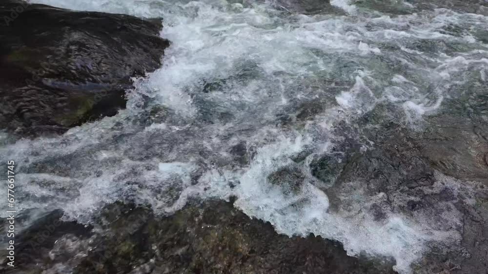small waterfall with clear crystal water in a forest stream, nature, slow motion small waterfall with clear crystal water in a forest stream, nature, slow motion