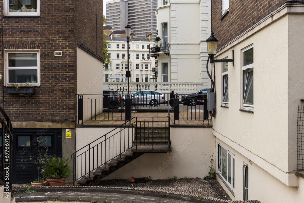 Looking between buildings into urban London neighborhood