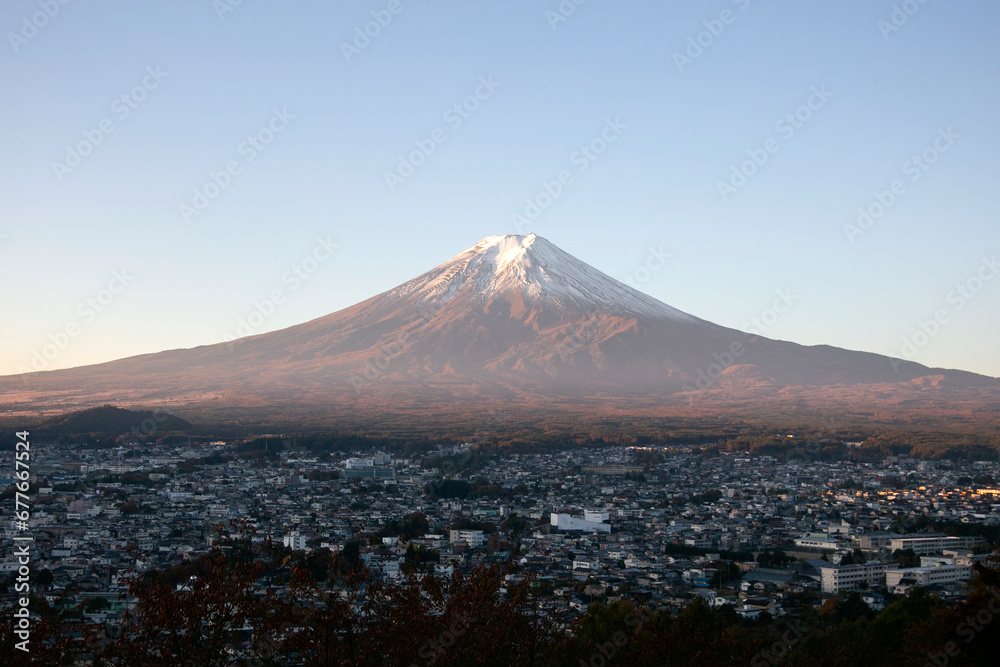Views of Mount Fuji at dawn from the Chureito Pagoda temple in Fujiyoshida, Japan.