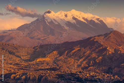 View of La Paz downtown at sunset with Mount Illimani in background, Bolivia.