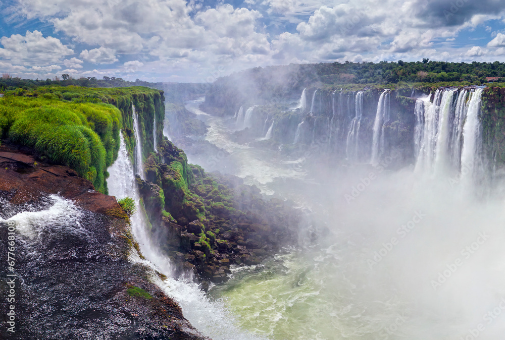 View of Iguazu Falls, waterfalls of the Iguazu River on Brazilian state of Paraná, Brazil. View of Iguazu Falls, waterfalls of the Iguazu River on Brazilian state of Paraná, Brazil.