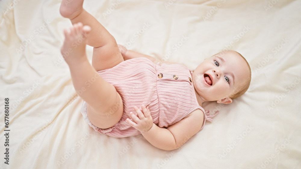 Adorable little newborn, comfortably relaxed on a cozy blanket, lying with a joyous laughter and a beautiful smiling mouth Adorable little newborn, comfortably relaxed on a cozy blanket, lying with a joyous laughter and a beautiful smiling mouth