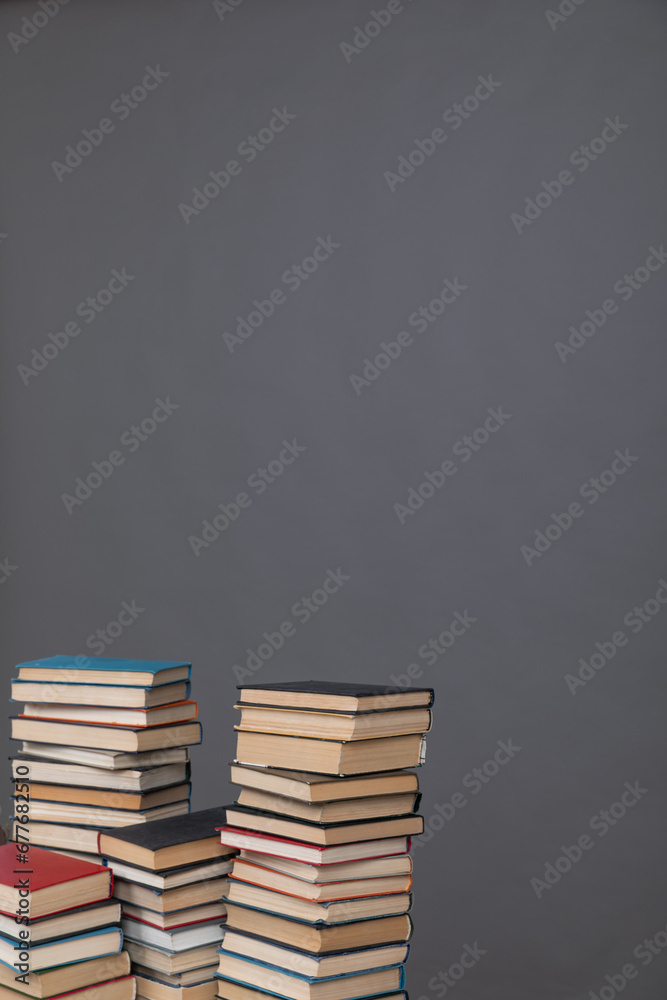 stack of books on grey background learning library learning science stack of books on grey background learning library learning science
