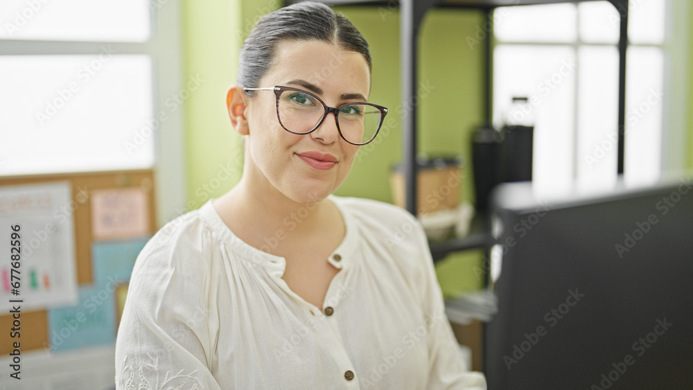 Young beautiful hispanic woman business worker using computer working at the office Young beautiful hispanic woman business worker using computer working at the office