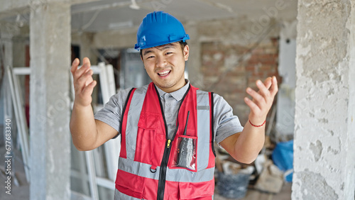  builder smiling confident speaking at construction site