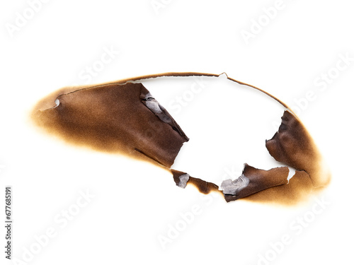 burned hole in paper isolated on white background