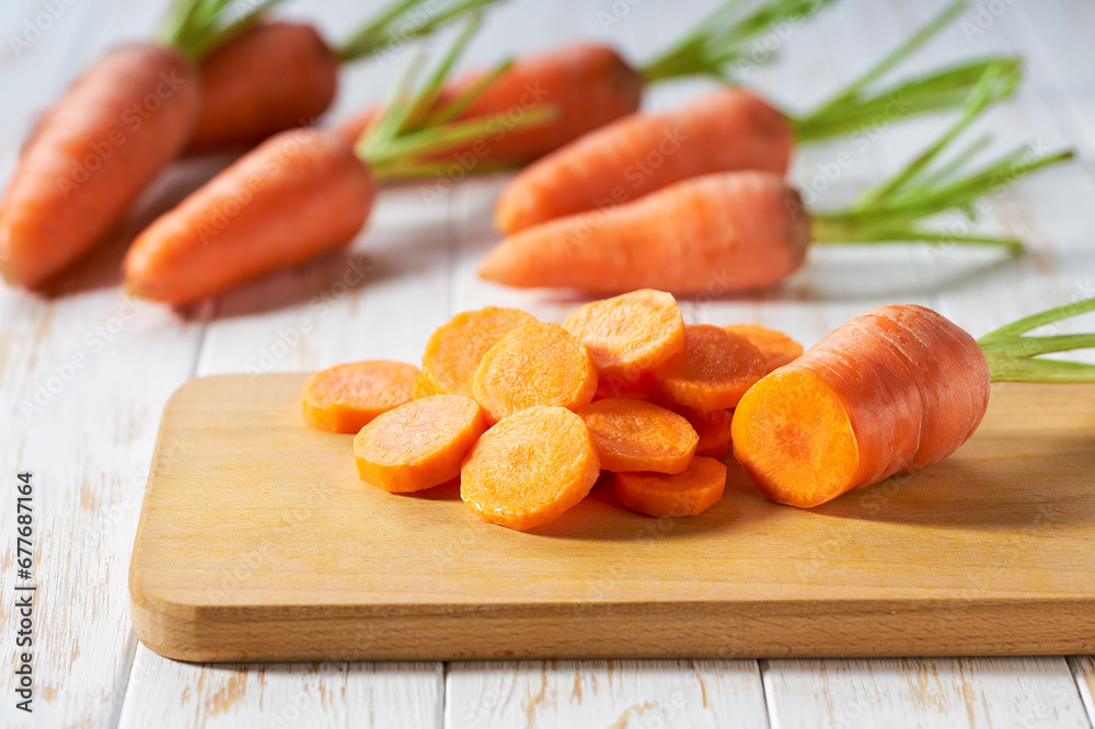 chopped carrots on a cutting board, selective focus. chopped carrots on a cutting board, selective focus.