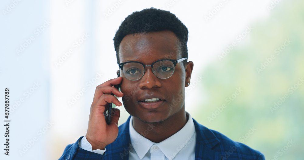 Business man, phone call and communication in office for consulting, corporate deal or chat to contact. Face of african worker, mobile networking or thinking of feedback, conversation and negotiation Business man, phone call and communication in office for consulting, corporate deal or chat to contact. Face of african worker, mobile networking or thinking of feedback, conversation and negotiation