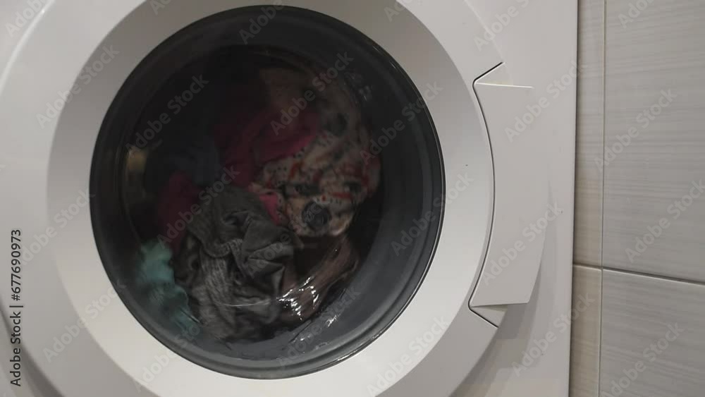 Spinning drum in a washing machine. Home work - washing things. Spinning drum in a washing machine. Home work - washing things.