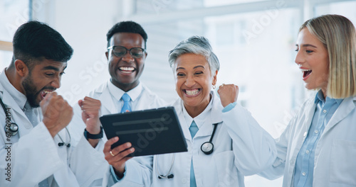 Doctors, teamwork and celebration on tablet for hospital results, healthcare solution and reading report with mentor. Professional medical group of people on digital technology for winning or success photo