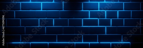 Black bricks wall texture iluminated with blue neon light. Illuminated brickwall banner with copy space. photo