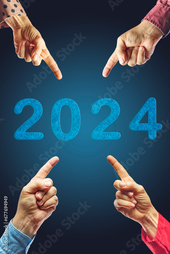 2024, People pointing to the number 2024 on blue background. Happy New Year